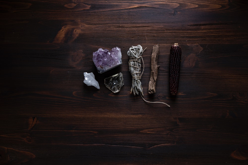 Magical tools - crystals, sage, wood, and corn