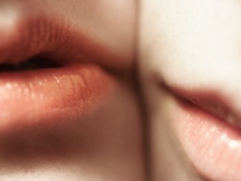 closeup of two faces showing just lips