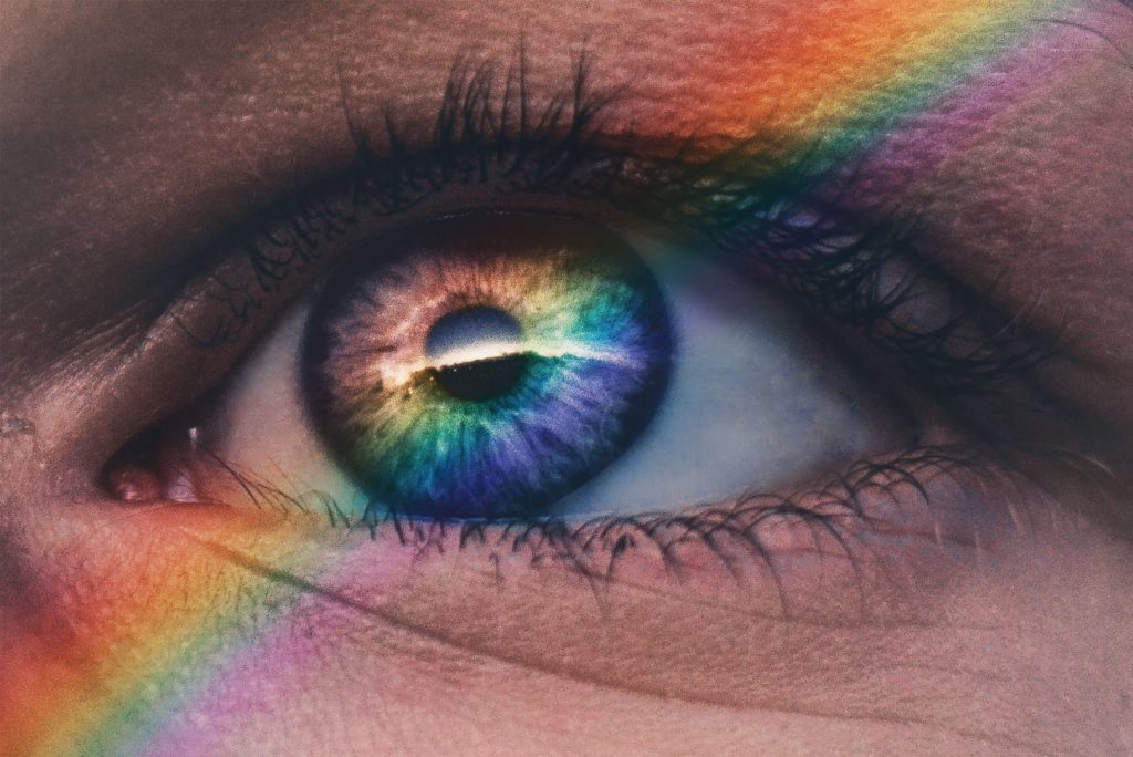 human eye with rainbow across it